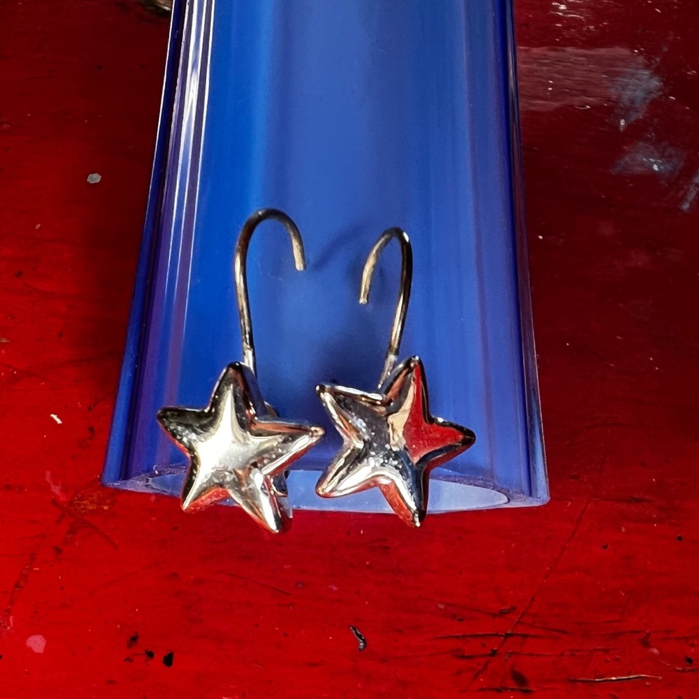 Silver tone star drop earrings